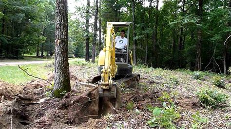 digging up stumps with mini excavator|pine tree stump removal machine.